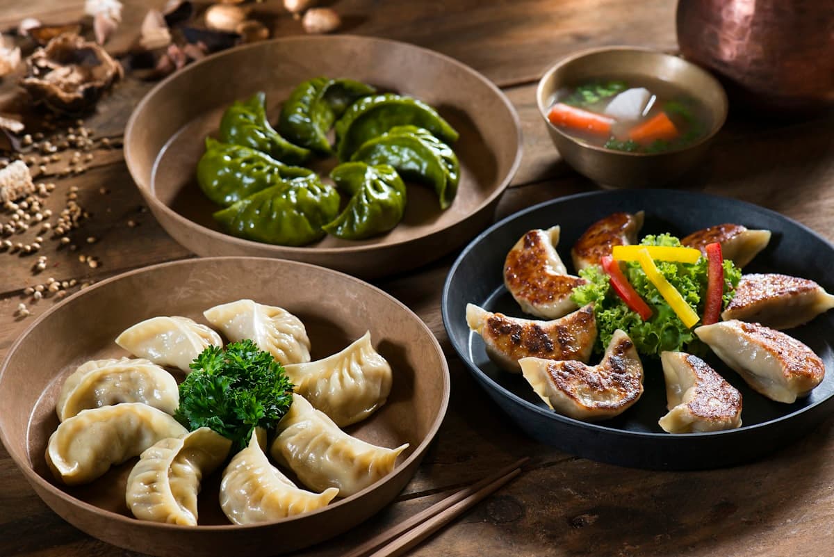Fresh homemade momo fillings and finished plates